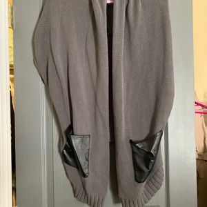Cardigan style sweater. Sleeveless